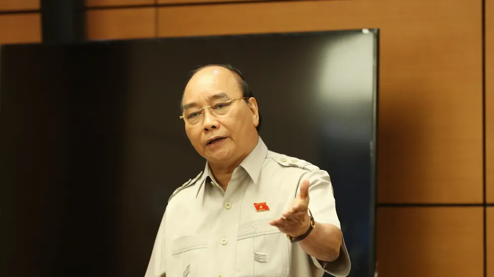 Chủ tịch nước Nguyễn Xuân Phúc phát biểu tại phiên họp tổ. Ảnh: QUANG PHÚC
