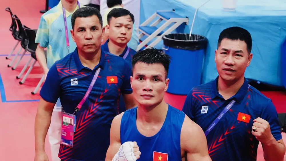 Tuyển thủ Nguyễn Văn Đương có chiến thắng trước đối thủ Nepal tại ASIAD 19. Ảnh: NAM TRUNG