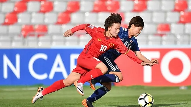 Đội tuyển nữ Việt Nam trong trận thua 0-7 trước Nhật Bản tại Asiad 2018, nhưng cả hai cùng vào vòng trong. Ảnh: AFC