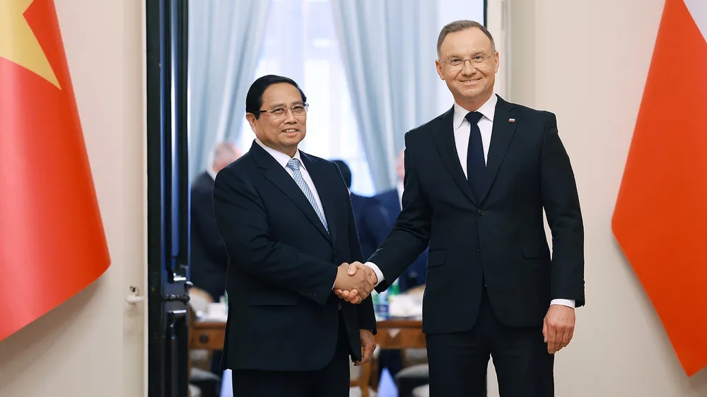 Thủ tướng Phạm Minh Chính và Tổng thống Ba Lan Andrzej Duda. Ảnh: TTXVN