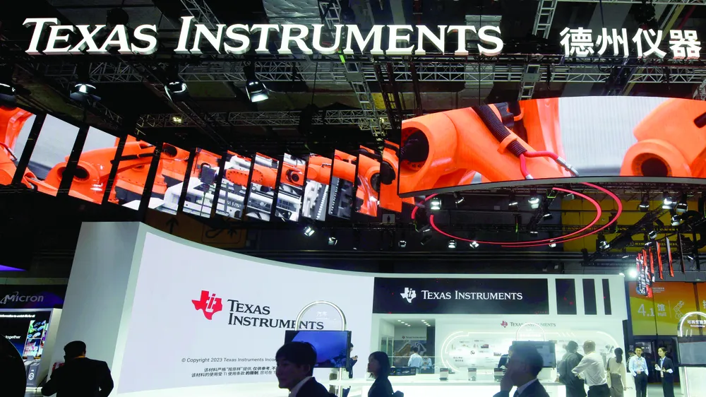 Gian hàng của Texas Instruments tại triển lãm nhập khẩu quốc tế ở Thượng Hải, Trung Quốc. Ảnh: AP