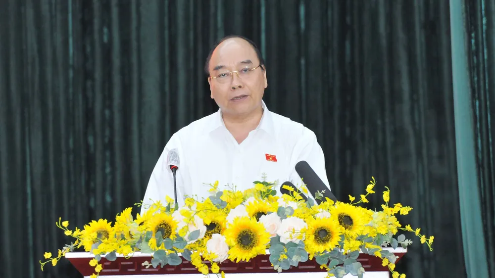 Chủ tịch nước Nguyễn Xuân Phúc phát biểu tại buổi tiếp xúc cử tri các quận 5, 8, 11. Ảnh: CAO THĂNG