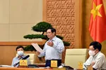 Thủ tướng Phạm Minh Chính chủ trì cuộc họp về phòng chống dịch Covid-19. Ảnh: VIẾT CHUNG