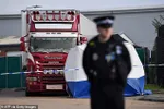 A police officer at the scene where the lorry was discovered in Grays, Essex, on October 23