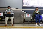 Benches at a station in Jakarta have been marked off to encourage social distancing. © Reuters