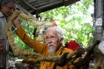 Nguyen Van Chien, 92, sits for a portrait to show his 5m long hair, which he said has not been cut for nearly 70 years, at his home in Tien Giang province, Vietnam, on Aug 21, 2020. (Photo: REUTERS/Yen Doung)