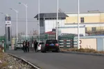 In this December 3, 2018, file photo, people walk by a police station by the front gate of the Artux City Vocational Skills Education Training Service Center in Artux in western China’s Xinjiang region. Credit: AP Photo/Ng Han Guan, File