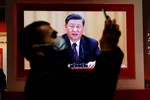 A screen showing Xi Jinping at an installation in Wuhan designed to extol the Chinese government’s handling of the coronavirus pandemic. The exhibition does not mention any of the Communist party’s failings © REUTERS