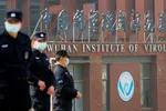 Security personnel keep watch outside the Wuhan Institute of Virology during the visit by the World Health Organization team in February © Reuters