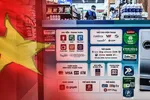 Vietnam has witnessed an explosion of digital wallets, such as MoMo, Grab's Moca, ZaloPay and VNPAY, used at businesses like this convenience store in Ho Chi Minh City. (Source photos by Lien Hoang and Ken Kobayashi) 