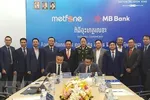 MB Cambodia and Metfone sign the contract in Phnom Penh on May 4. (Photo: VNA)
