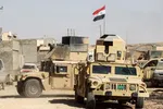 Xe Humvee và các phương tiện của lực lượng Huy động Nhân dân bên trong thị trấn Tal Afar, phía tây Mosul, vào ngày 25 tháng 8 năm 2017. Ảnh: AFP / Ahmad Al-Rubaye