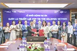 Bà Phạm Thị Vân Hà – Chủ tịch HĐQT TNR Holdings Vietnam và ông Đinh Tiên Hoàng – TGĐ khối Dịch vụ ERP, Công ty Hệ thống thông tin FPT ký kết hợp tác