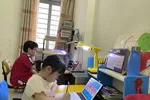 Học sinh tiểu học ở TP.HCM làm quen với việc học trực tuyến, chuẩn bị cho việc học chính thức từ ngày 20-9 - Ảnh: GIA HUY