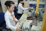 Hơn 70% người dân nhận kiều hối chuyển sang VND. (Ảnh: Vietnam+)