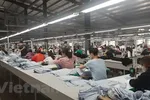 Sản xuất dệt may tại doanh nghiệp Tiên Sơn. (Ảnh: Vietnam+)
