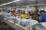 Sản xuất dệt may tại doanh nghiệp Tiên Sơn. (Ảnh: Vietnam+)