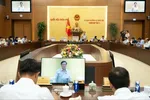 Phó Chủ tịch Quốc hội Nguyễn Khắc Định điều hành một phiên thảo luận trong khuôn khổ phiên họp thứ 4 của UBTVQH. Ảnh: CẨM HÀ