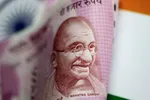 The Indian rupee fell to its lowest value against the dollar on record Thursday due to economic fallout concerns. © Reuters