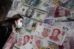 Emerging Asian currencies have nosedived against the dollar during the coronavirus crisis at investors seek the haven of the greenback. © AP