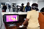 Passengers arrive at the airport in Lagos, Nigeria, where authorities have heightened screening measures. PHOTO: PIUS UTOMI EKPEI/AGENCE FRANCE-PRESSE/GETTY IMAGES