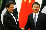 Chinese President Xi Jinping, right, greets Pakistani Prime Minister Imran Khan in Beijing, in November 2018. Khan must balance ties with Beijing and acting to protect public health in Pakistan. © Reuters
