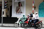 Stores in Hanoi began reopening Thursday after Vietnam eased three-week-old restrictions on movement. PHOTO: KHAM/REUTERS