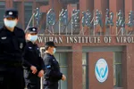 Security personnel outside the Wuhan Institute of Virology during a visit by the World Health Organisation in February. US intelligence officials are investigating whether the facility could have played a role in the origins of Covid-19. © Thomas Peter/RE