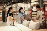 People check pillows inside Muji's first store in Hanoi. Photo by VnExpress.