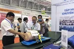 Visitors to the 20th International Medical, Hospital & Pharmaceutical Exhibition that opened on August 11 in HCM City. (Photo: VNA)