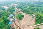 Hiện trường sạt lở đất do lũ quét tại quận Vĩnh Xuyên, Trùng Khánh, Trung Quốc, ngày 25-5. Ảnh: THX/TTXVN.