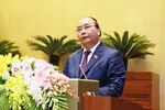 Thủ tướng Nguyễn Xuân Phúc trình bày báo cáo trước Quốc hội. Ảnh VGP
