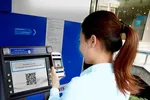 TPHCM: Không còn cảnh xếp hàng chờ rút tiền mặt ở các trụ ATM