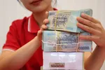 Giảm mặt bằng lãi suất để duy trì ổn định thị trường tiền tệ