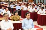 Đồng chí Trần Lưu Quang và đồng chí Nguyễn Phước Lộc dự hội nghị tại điểm cầu TPHCM. Ảnh: VIỆT DŨNG