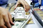Vàng và USD đồng loạt tăng giá mạnh