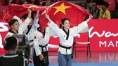 Taekwondo Việt Nam thi đấu nội dung quyền sáng tạo đồng đội kết hợp. Ảnh: DŨNG PHƯƠNG