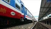 A worker cleans a train on the North-South line. (Photo: VNA)