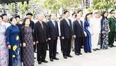 The HCMC delegates offer flowers at President Ho Chi Minh statue. Picture: QUANG HUY