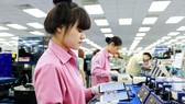 Workers at the smart phone production of Samsung SEVT plant in the northern province of Thai Nguyen