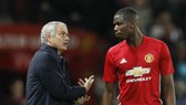 Paul Pogba và Jose Mourinho trong một lần tranh cãi. Ảnh: Getty Images