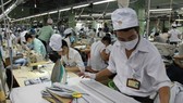 Workers at a garment-textile export company in Vietnam's southern Binh Duong province (Photo: VNA)