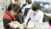 Parents should take their children to hospital for vaccination against measles (PHoto: SGGP)