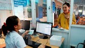 Health care facilities are required to apply electronic health care record before 2028. (Photo: VNA)