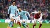 Ilkay Gundogan (giữa) lo ngại về màn tái đấu Arsenal sau 4 ngày. Ảnh: Getty Images