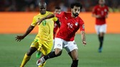 Mohamed Salah (phải) không thành công cùng tuyển Ai Cập nên sẽ trở lại sớm. Ảnh: Getty Images