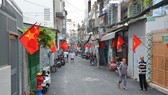 Một con hẻm ở quận 3 được người dân hiến đất mở rộng, khang trang, sạch đẹp. Ảnh: VIỆT DŨNG