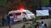An ambulance leave the Tham Luang cave area as divers evacuated some of the 12 boys and their coach trapped at the cave in Khun Nam Nang Non Forest Park in the Mae Sai district of Chiang Rai province on Sunday. — AFP/VNA Photo