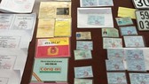 Tang vật 1 vụ làm giả giấy tờ trước đó. Ảnh: Đ.N.