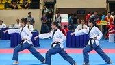Chiếc HCV đầu tiên của Taekwondo Việt Nam tại giải do công cùa bộ ba Nguyễn Thị Kim Hà – Lê Trần Kim Uyên – Ngô Thị Thuỳ Dung. Ảnh: Dũng Phương